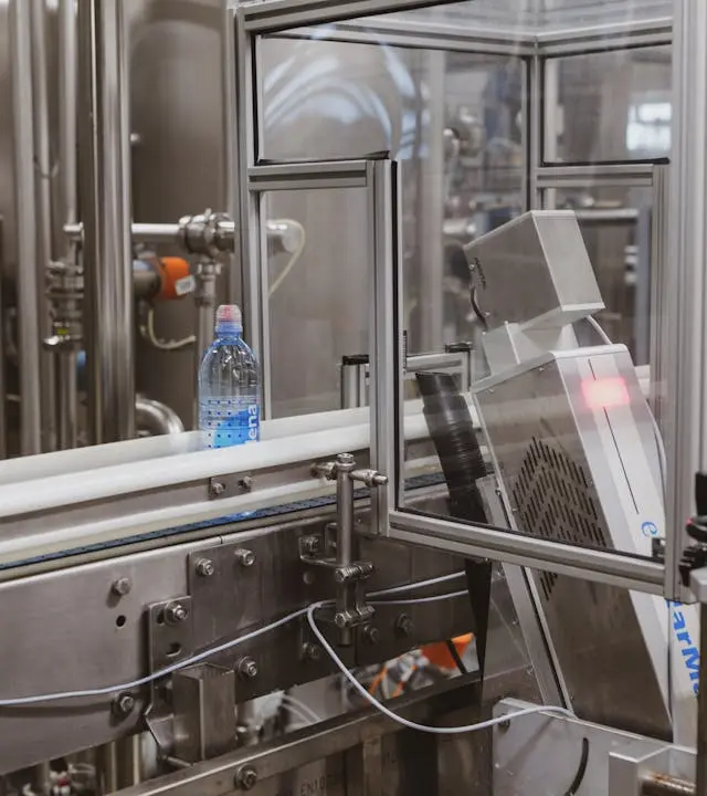 Bottle production line inside a factory Bottle production line inside a factory